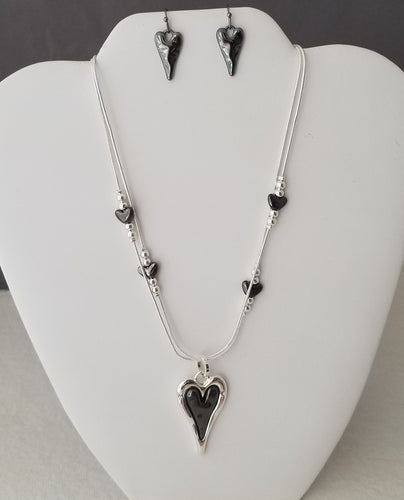 Double strand Necklace with Black & Silver heart Pendant with small heat stations with silver beads. 18 in Necklace with 2 in extension. Shepard hook earrings