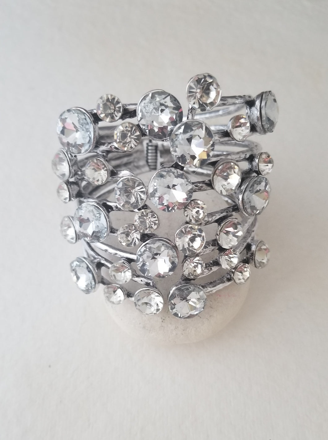 Large Bracelet with round CZ's Hinged in the back with front opening. This Bracelet is a Beautiful Statement piece.  Bracelet face is 3in x 3 in.  Fits average to large wrist