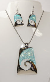 Beautiful Necklace & Earrings  Ocean Wave Set with a 18 inch chain and 2 inch extender It shimmering light blue resin resembling the beautiful waters of the Sea.