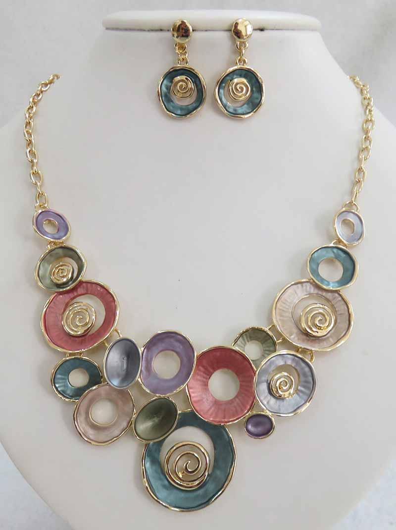 Beautiful circles of blue, grey, coral, taupe, with gold colored swirls and chain. Earrings included. 18 inches with 2 inch extender