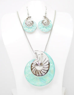 Beautiful Necklace & Earrings Round Sculpture Spiral Snail shape with a 18 inch chain and 2 inch extender It shimmering light blue resin resembling the beautiful waters of the Sea