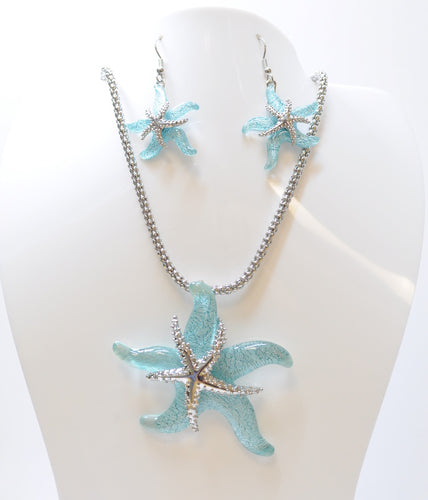 Beautiful Necklace & Earrings Starfish Set with a 18 inch chain and 2 inch extender It shimmering light blue resin resembling the beautiful waters of the Sea